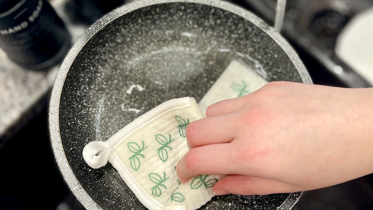 Washing a nonstick pan with a Swedish dishcloth