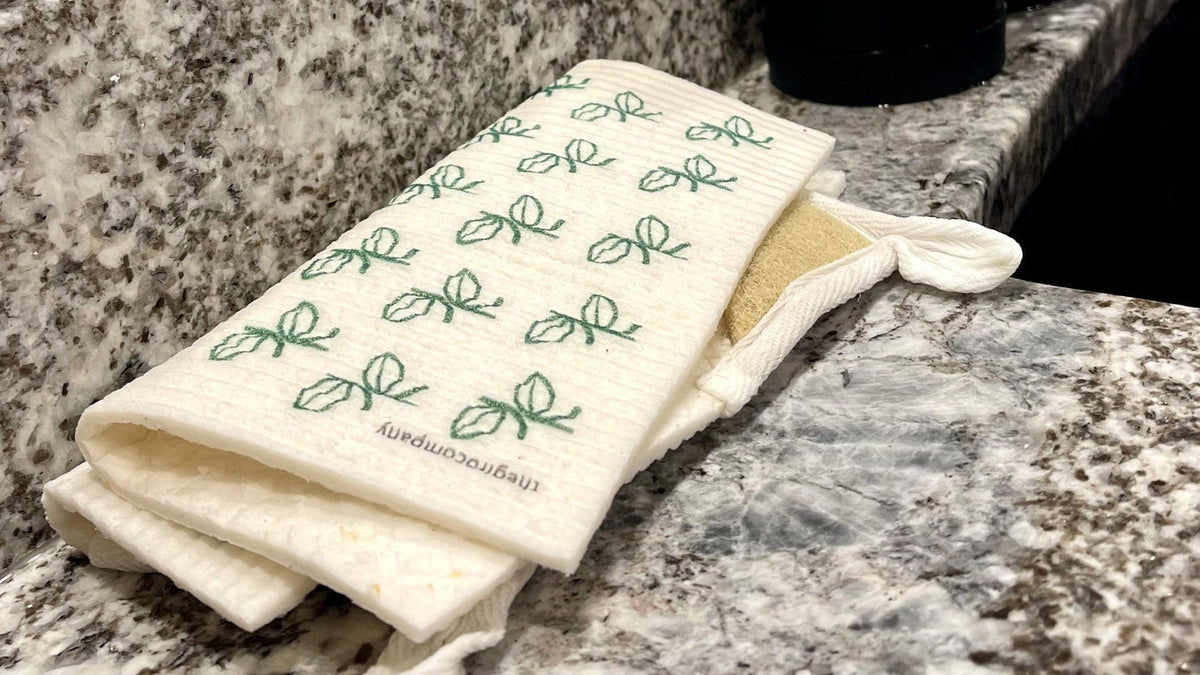 Folded Swedish dishcloth resting beside a kitchen sink